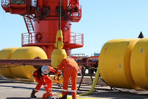 Two University of South Florida researchers get ready to deploy buoy