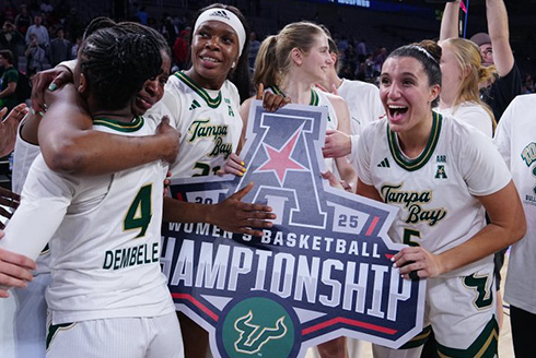 women's basketball team celebrates