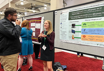 University of South Florida scholar Claire Smith presents her research findings at the Society for Industrial and Organizational Psychology conference in 2023. Credit: Mia Nguyen    125%