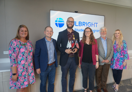 Larry Grullon-Polanco with faculty at Fulbright Award Ceremony