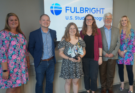 Molly Schilling with faculty at Fulbright Award Ceremony. 