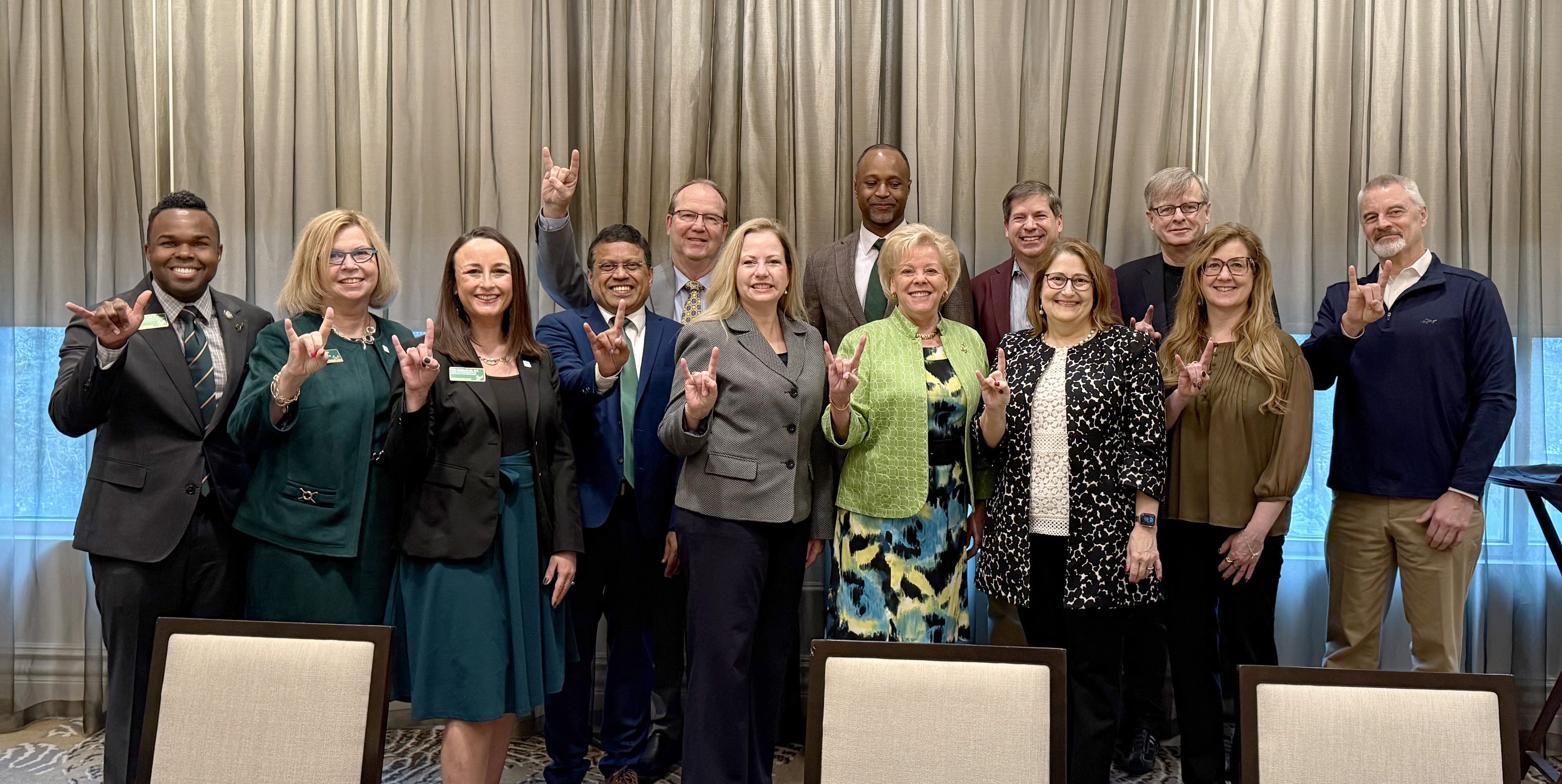 USF team members join President Rhea Law for a group photo during the Celebrating a successful site visit from Southern Association of Colleges and Schools Commission on Colleges site visit.