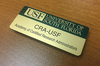 CRA-USF badge