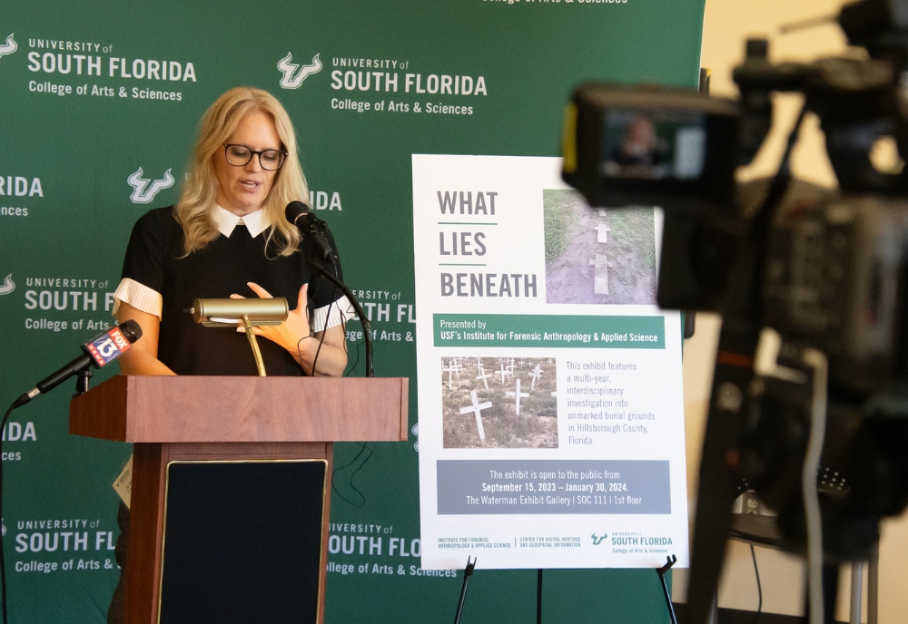 Professor Kimmerle speaks to media at the "What Lies Beneath" exhibit.