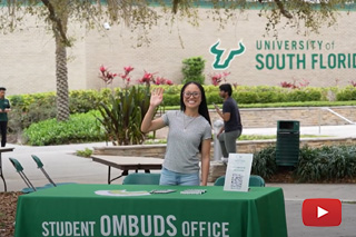 student waving