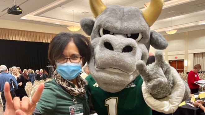 testing services director Leonor o'relly poses with rocky the bull
