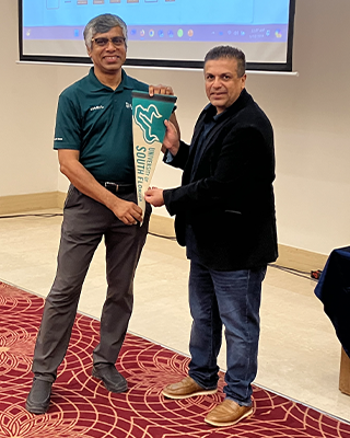 Aditya Raj Mankani gets a USF pennat from Prof Kaushik Dutta after the student session in Hyderabad