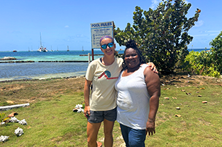 Dr. Begin and local resident of union island stand together smiling