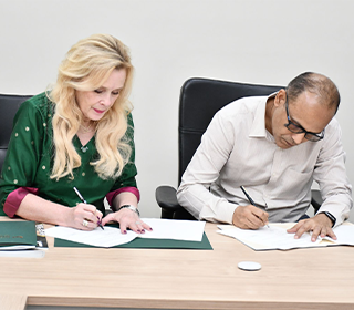 BITS Pilani and USF representatives signing an official document