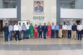 A group standing in the lobby of SRM University: Prof. Manoj K Arora, Vice Chancellor, SRM University-AP, Dr Prashant Mohapatra, Provost & Executive Vice President of the University of South Florida, along with Dr Kiki Caruson, Vice President, USF