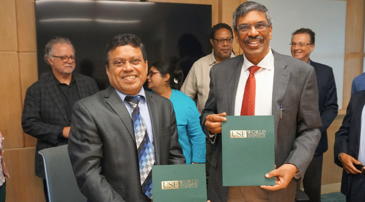 USF Provost Dr. Prasant Mohapatra and ITTGN Director Dr. Rajat Moona show the newly signed General Agreement for Collaboration between their respective institutions