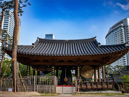 korean pagoda featured with cityscape of Seoul in the background