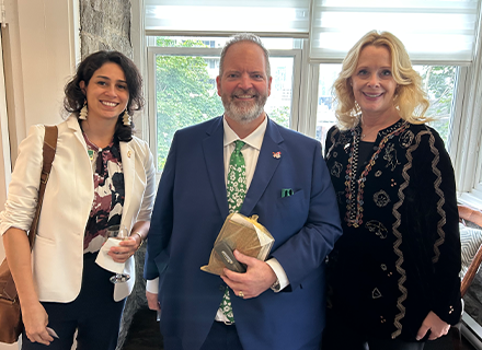 Vanessa Martinez and Kiki Caurson flanking US COnsul General Robert Sanders in Montreal, Canada.