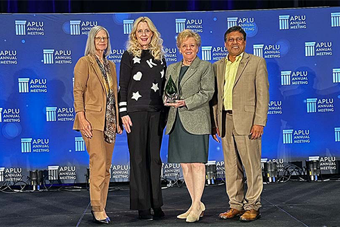 USF Innovative Education AVP, USF World Vice President, USF President, and Provost accept APLU award