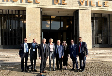 Tampa Bay mayor, Jane Castor, stands with sister-city representatives from Le Havre, France, in front of Hotel de Ville