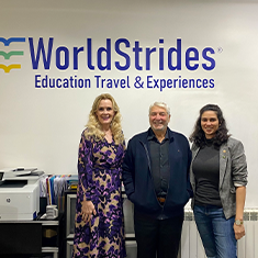 Dr. Kiki Caruson (left) and Vanessa Martinez (right) stand with a World Strides representative during a visit to France