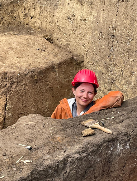 student wearinga safety hat in an old grave