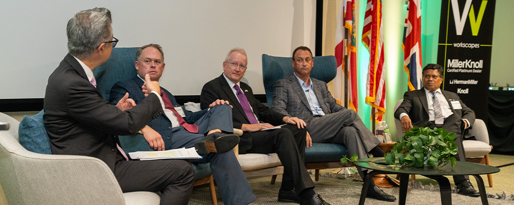 five people sitting on a panel discussion