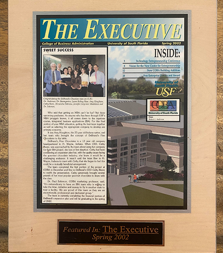 A framed article from The Executive Newspaper