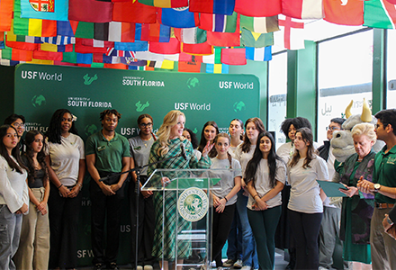 Dr. Kiki Caruson speaks to international students and event attendees