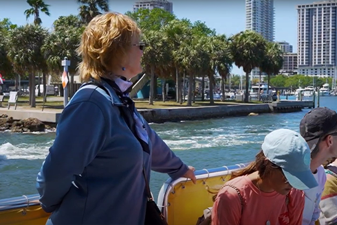 Kimberly Brooke Hansen on a boat with tourists