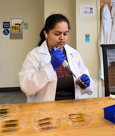 Nirmita in a lab using lab equipment