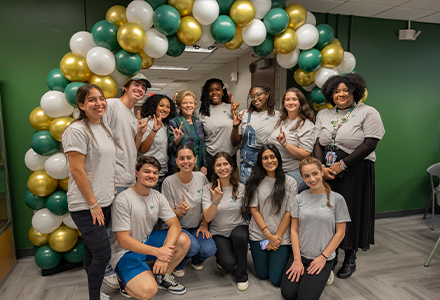 students with USF President Rhea Law