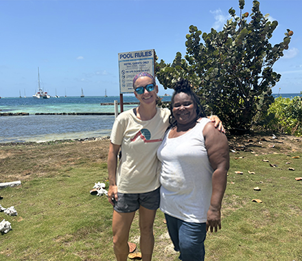 Dr. Begin and local resident of union island stand together smiling