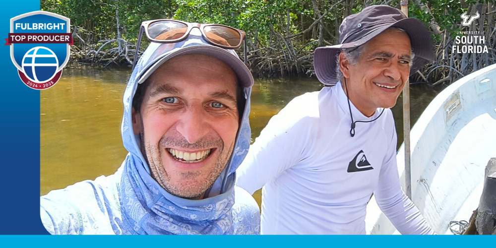 fulbright scholar and another person are on a boat