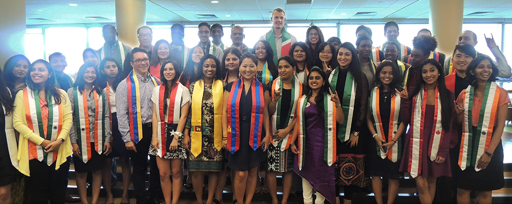 Group of students with sashes from different countries