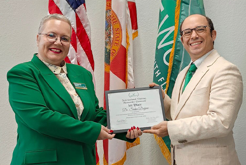 USF professor Seden Dogan receives honor from USF World's Brandon McLeod